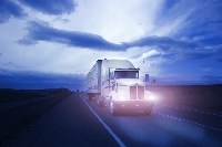Photo of Truck driving at dusk